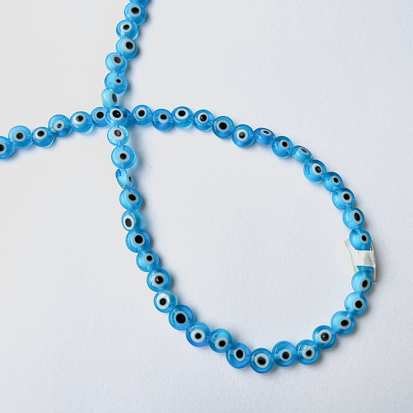 Sarta Ojo de Vidrio Azul Claro-Plano 6mm 🩵
